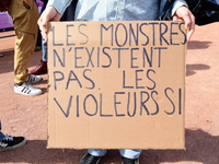 Several women and men gather with placards to support Gisele Pelicot and all rape victims in Lyon, France, on September 14, 2024. (