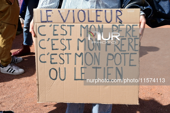 Several women and men gather with placards to support Gisele Pelicot and all rape victims in Lyon, France, on September 14, 2024. 