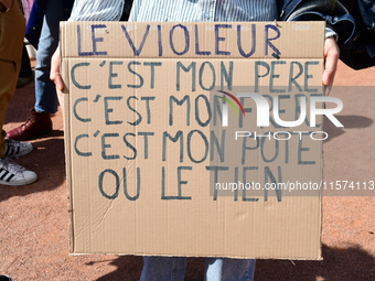 Several women and men gather with placards to support Gisele Pelicot and all rape victims in Lyon, France, on September 14, 2024. (