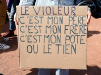 Several women and men gather with placards to support Gisele Pelicot and all rape victims in Lyon, France, on September 14, 2024. (