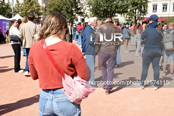 Several women and men gather with placards to support Gisele Pelicot and all rape victims in Lyon, France, on September 14, 2024. 