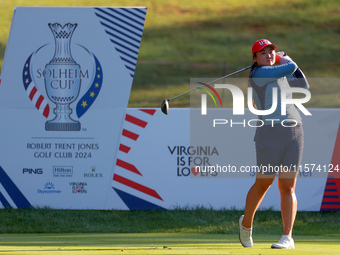 GAINESVILLE, VIRGINIA - SEPTEMBER 14: Allisen Corpuz of the United States hits from the 7th tee with her caddie during Day Two of the Solhei...