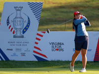 GAINESVILLE, VIRGINIA - SEPTEMBER 14: Allisen Corpuz of the United States hits from the 7th tee with her caddie during Day Two of the Solhei...