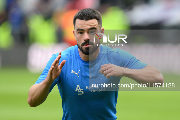 Eiran Cashin of Derby County warms up ahead of kick-off during the Sky Bet Championship match between Derby County and Cardiff City at Pride...