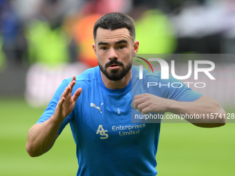 Eiran Cashin of Derby County warms up ahead of kick-off during the Sky Bet Championship match between Derby County and Cardiff City at Pride...