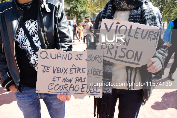 Several women and men gather with placards to support Gisele Pelicot and all rape victims in Lyon, France, on September 14, 2024. 