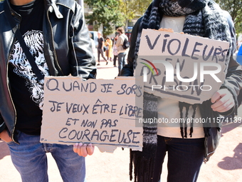 Several women and men gather with placards to support Gisele Pelicot and all rape victims in Lyon, France, on September 14, 2024. (