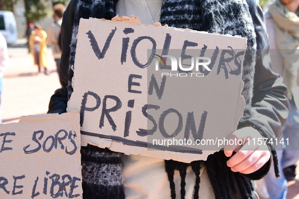 Several women and men gather with placards to support Gisele Pelicot and all rape victims in Lyon, France, on September 14, 2024. 