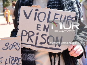 Several women and men gather with placards to support Gisele Pelicot and all rape victims in Lyon, France, on September 14, 2024. (