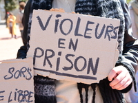 Several women and men gather with placards to support Gisele Pelicot and all rape victims in Lyon, France, on September 14, 2024. (