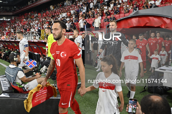 Hakan Calhanoglu and Mert Gunok of Turkey  during the UEFA Nations League 2024/25 League B Group B4 match between Turkiye and Iceland at Gur...