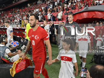 Hakan Calhanoglu and Mert Gunok of Turkey  during the UEFA Nations League 2024/25 League B Group B4 match between Turkiye and Iceland at Gur...