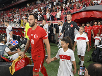 Hakan Calhanoglu and Mert Gunok of Turkey  during the UEFA Nations League 2024/25 League B Group B4 match between Turkiye and Iceland at Gur...