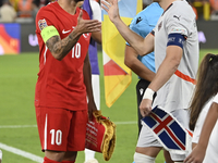 Hakan Calhanoglu of Turkey and Johann Gudmundsson of Iceland   during the UEFA Nations League 2024/25 League B Group B4 match between Turkiy...