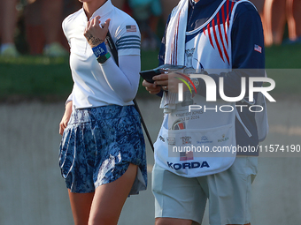 GAINESVILLE, VIRGINIA - SEPTEMBER 14: Nelly Korda of the United States waits with her caddie on the 7th green during Day Two of the Solheim...