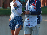 GAINESVILLE, VIRGINIA - SEPTEMBER 14: Nelly Korda of the United States waits with her caddie on the 7th green during Day Two of the Solheim...