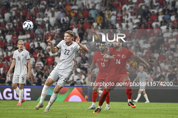 Andri Gudjohnsen of Iceland and Abdulkerim Bardakci of Turkey  during the UEFA Nations League 2024/25 League B Group B4 match between Turkiy...