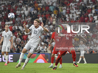 Andri Gudjohnsen of Iceland and Abdulkerim Bardakci of Turkey  during the UEFA Nations League 2024/25 League B Group B4 match between Turkiy...