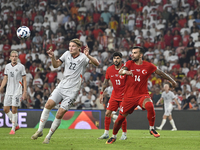 Andri Gudjohnsen of Iceland and Abdulkerim Bardakci of Turkey  during the UEFA Nations League 2024/25 League B Group B4 match between Turkiy...