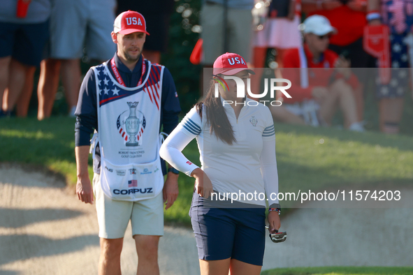 GAINESVILLE, VIRGINIA - SEPTEMBER 14: Allisen Corpuz of the United States looks over the 7th green  with her caddie during Day Two of the So...