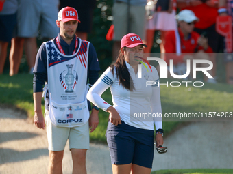 GAINESVILLE, VIRGINIA - SEPTEMBER 14: Allisen Corpuz of the United States looks over the 7th green  with her caddie during Day Two of the So...