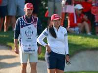 GAINESVILLE, VIRGINIA - SEPTEMBER 14: Allisen Corpuz of the United States looks over the 7th green  with her caddie during Day Two of the So...