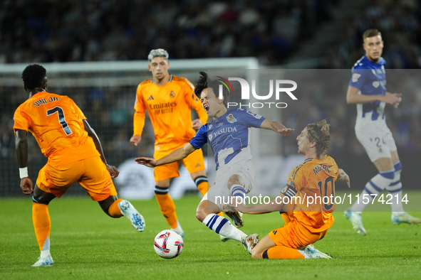 Takefusa Kubo right winger of Real Sociedad and Japan and Luka Modric central midfield of Real Madrid and Croatia compete for the ball durin...