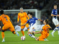 Takefusa Kubo right winger of Real Sociedad and Japan and Luka Modric central midfield of Real Madrid and Croatia compete for the ball durin...