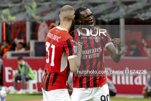 Strahinja Pavlovic and Tammy Abraham celebrate after scoring a goal during the Serie A football match between AC Milan and Venezia FC in Mil...