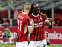 Strahinja Pavlovic and Tammy Abraham celebrate after scoring a goal during the Serie A football match between AC Milan and Venezia FC in Mil...