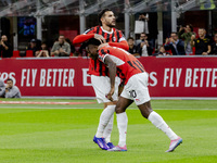 Theo Hernandez and Rafael Leao celebrate after scoring a goal during the Serie A football match between AC Milan and Venezia FC in Milano, I...