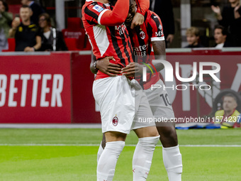 Theo Hernandez and Rafael Leao celebrate after scoring a goal during the Serie A football match between AC Milan and Venezia FC in Milano, I...