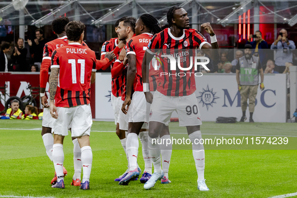 Theo Hernandez and Tammy Abraham celebrate after scoring a goal during the Serie A football match between AC Milan and Venezia FC in Milano,...