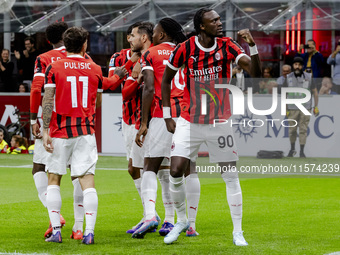 Theo Hernandez and Tammy Abraham celebrate after scoring a goal during the Serie A football match between AC Milan and Venezia FC in Milano,...