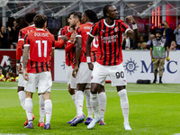 Theo Hernandez and Tammy Abraham celebrate after scoring a goal during the Serie A football match between AC Milan and Venezia FC in Milano,...