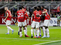 Theo Hernandez celebrates after scoring a goal during the Serie A football match between AC Milan and Venezia FC in Milano, Italy, on Septem...