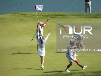 GAINESVILLE, VIRGINIA - SEPTEMBER 14: Megan Khang of the United States celebrates her putt on the 11th with teammates during Fourball Matche...