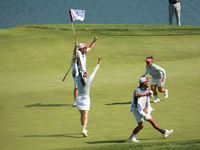 GAINESVILLE, VIRGINIA - SEPTEMBER 14: Megan Khang of the United States celebrates her putt on the 11th with teammates during Fourball Matche...