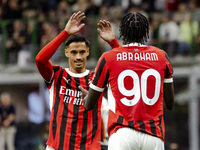 Tammy Abraham and Tijjani Reijnders are in action during the Serie A match between AC Milan and Venezia FC in Milano, Italy, on September 14...