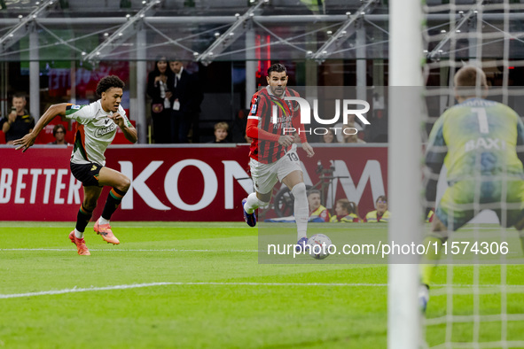 Theo Hernandez plays during the Serie A match between AC Milan and Venezia FC in Milano, Italy, on September 14, 2024, at Stadio Giuseppe Me...