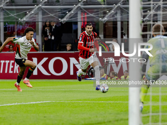 Theo Hernandez plays during the Serie A match between AC Milan and Venezia FC in Milano, Italy, on September 14, 2024, at Stadio Giuseppe Me...