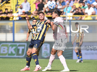 Dimitris Nikolaou of Palermo FC competes for the ball with Andrea Adorante of SS Juve Stabia during the Serie B match between SS Juve Stabia...