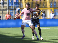 Marco Ruggero of SS Juve Stabia competes for the ball with Thomas Henry of Palermo FC during the Serie B match between SS Juve Stabia and Pa...