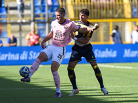 Marco Ruggero of SS Juve Stabia competes for the ball with Thomas Henry of Palermo FC during the Serie B match between SS Juve Stabia and Pa...