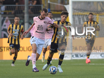 Jeremy Le Douaron of Palermo FC competes for the ball with Romano Floriani Mussolini of SS Juve Stabia during the Serie B match between SS J...