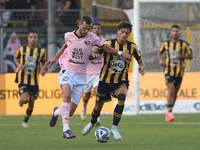 Jeremy Le Douaron of Palermo FC competes for the ball with Romano Floriani Mussolini of SS Juve Stabia during the Serie B match between SS J...