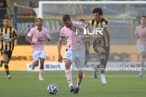 Jeremy Le Douaron of Palermo FC competes for the ball with Romano Floriani Mussolini of SS Juve Stabia during the Serie B match between SS J...