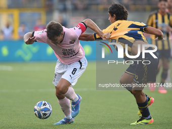 Jacopo Segre of Palermo FC competes for the ball with Giuseppe Leone of SS Juve Stabia during the Serie B match between SS Juve Stabia and P...