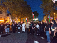 Nearly a hundred Iranian activists take part in a candlelight vigil for the second anniversary of Mahsa Amini's death in Cologne, Germany, o...