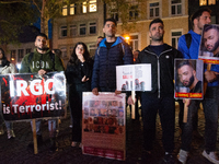 Nearly a hundred Iranian activists take part in a candlelight vigil for the second anniversary of Mahsa Amini's death in Cologne, Germany, o...